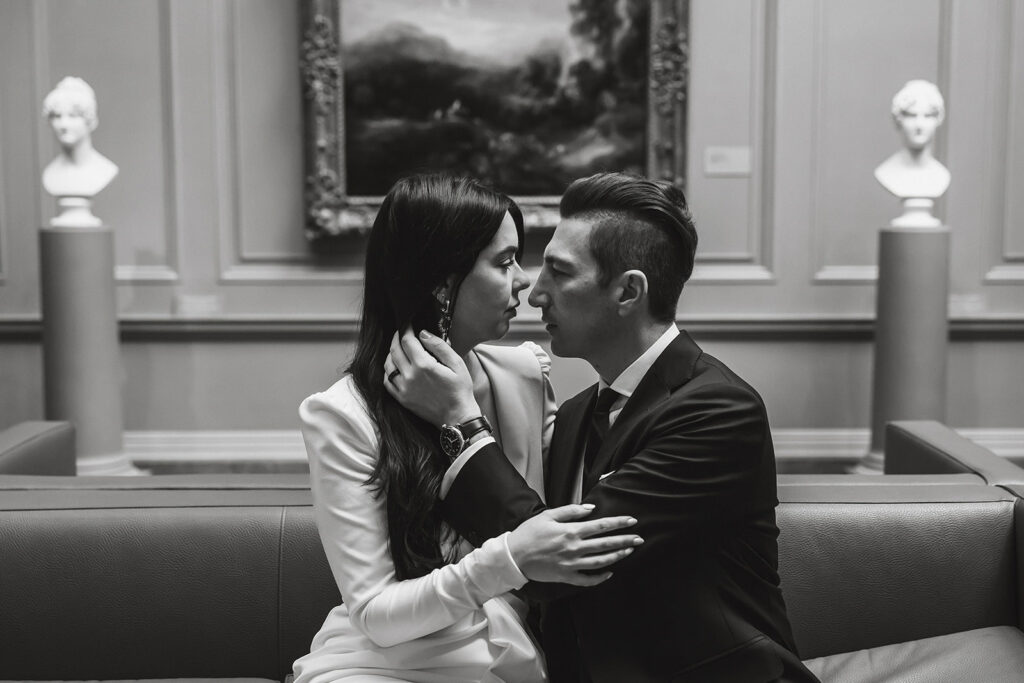 the wedding couple about to kiss at the National Gallery of Art during their DC elopement