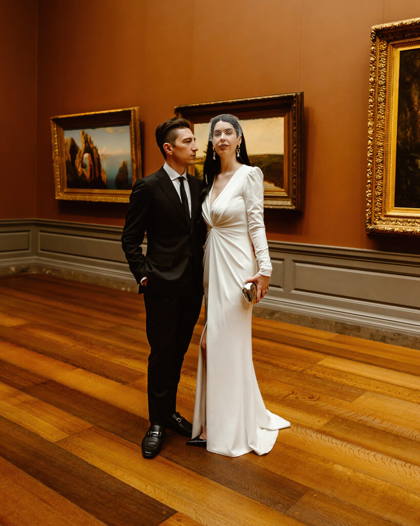 the wedding couple posing at the National Gallery of Art