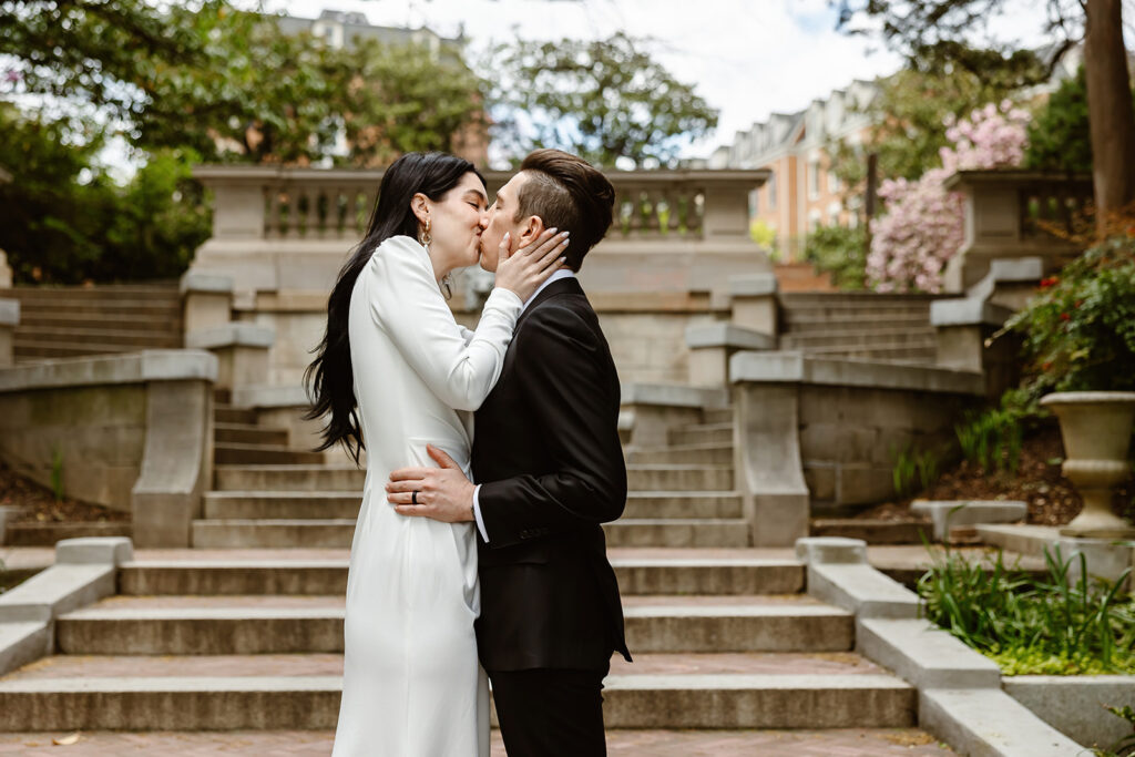 the wedding couple kissing during their elopement ceremony