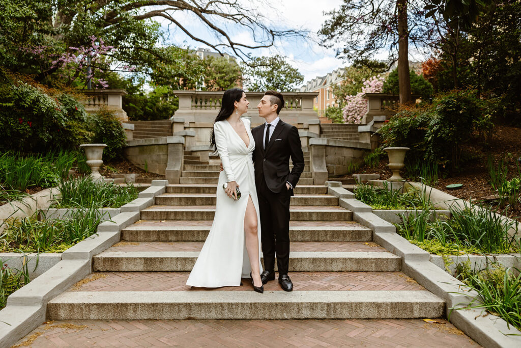 the wedding couple posing on the Spanish Steps for their elopement ceremony