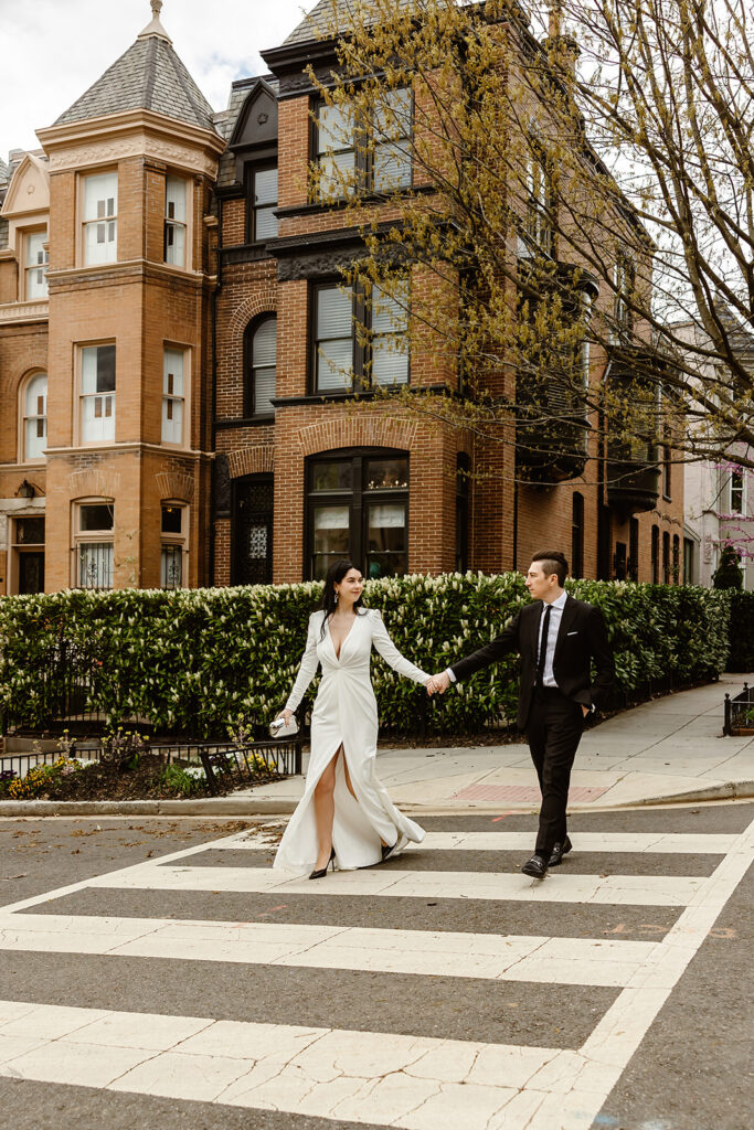 the wedding couple walking across the street in Georgetown