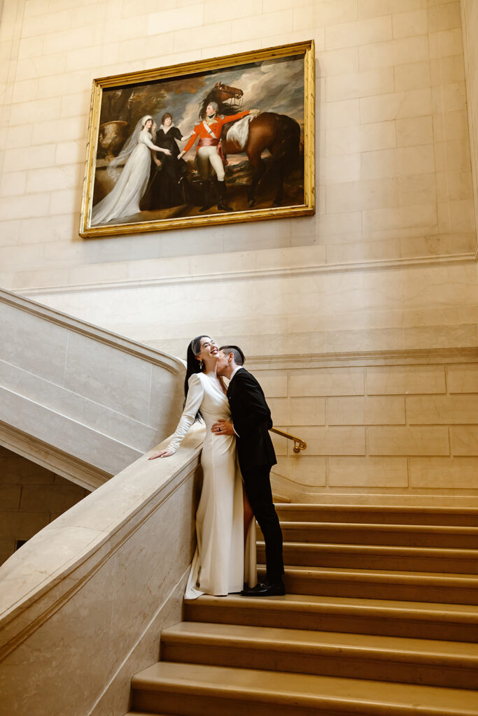 the wedding couple on the stairs in the National Gallery of Art