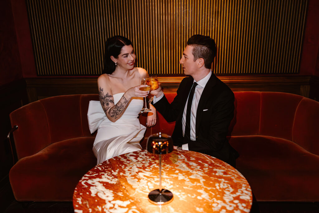 the wedding couple enjoying drinks at their elopement reception in Washington DC