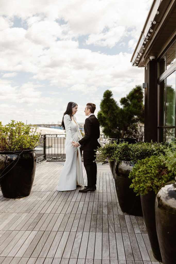 the wedding couple on the rooftop after their first look