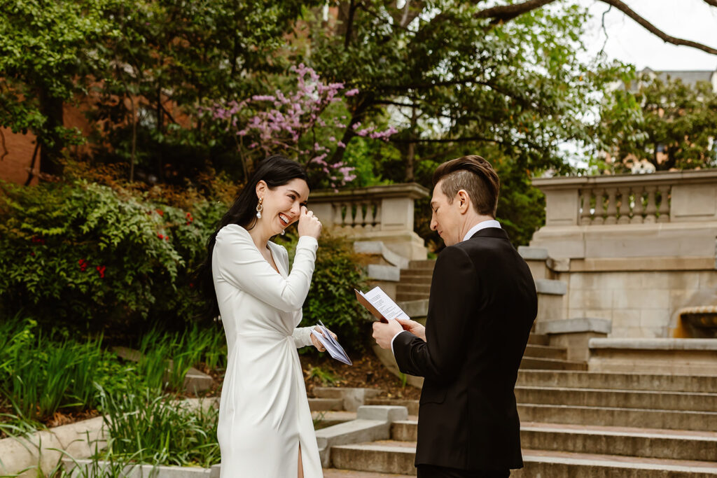 the wedding couple saying their vows to each other on the Spanish Steps