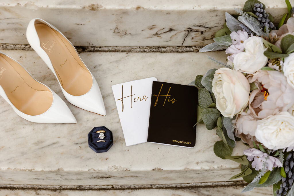 wedding detail photography of vow books and wedding details