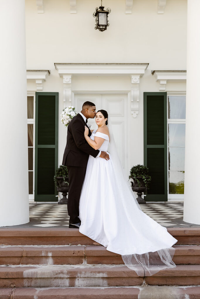 elopement couple posing on the stairs for their elopement ceremony