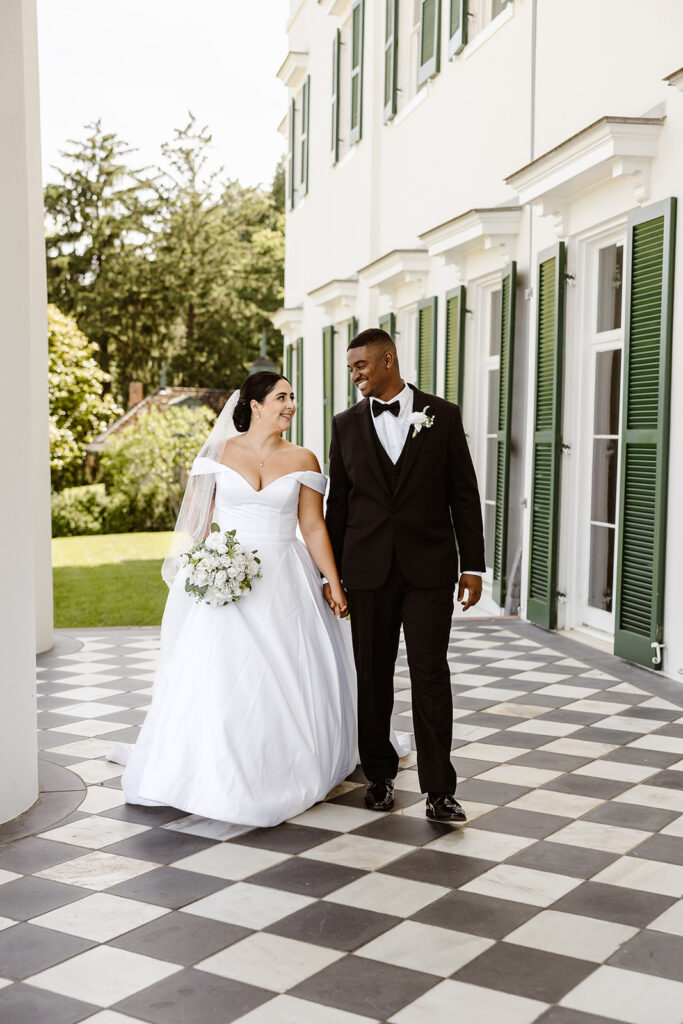 the wedding couple walking towards the elopement photographer