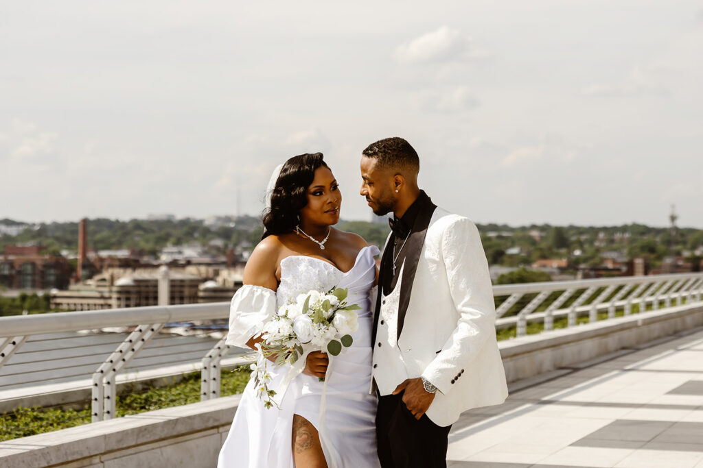elegant bride and groom on the rooftop of the kennedy center