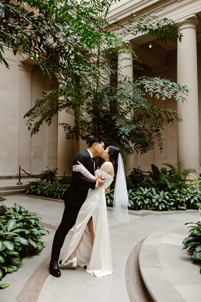 the elopement couple surrounded by greenery for elopement photos