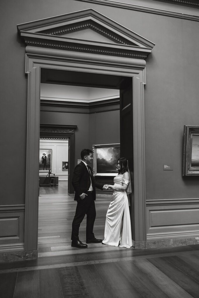 the wedding couple at the National Gallery of Art in black and white