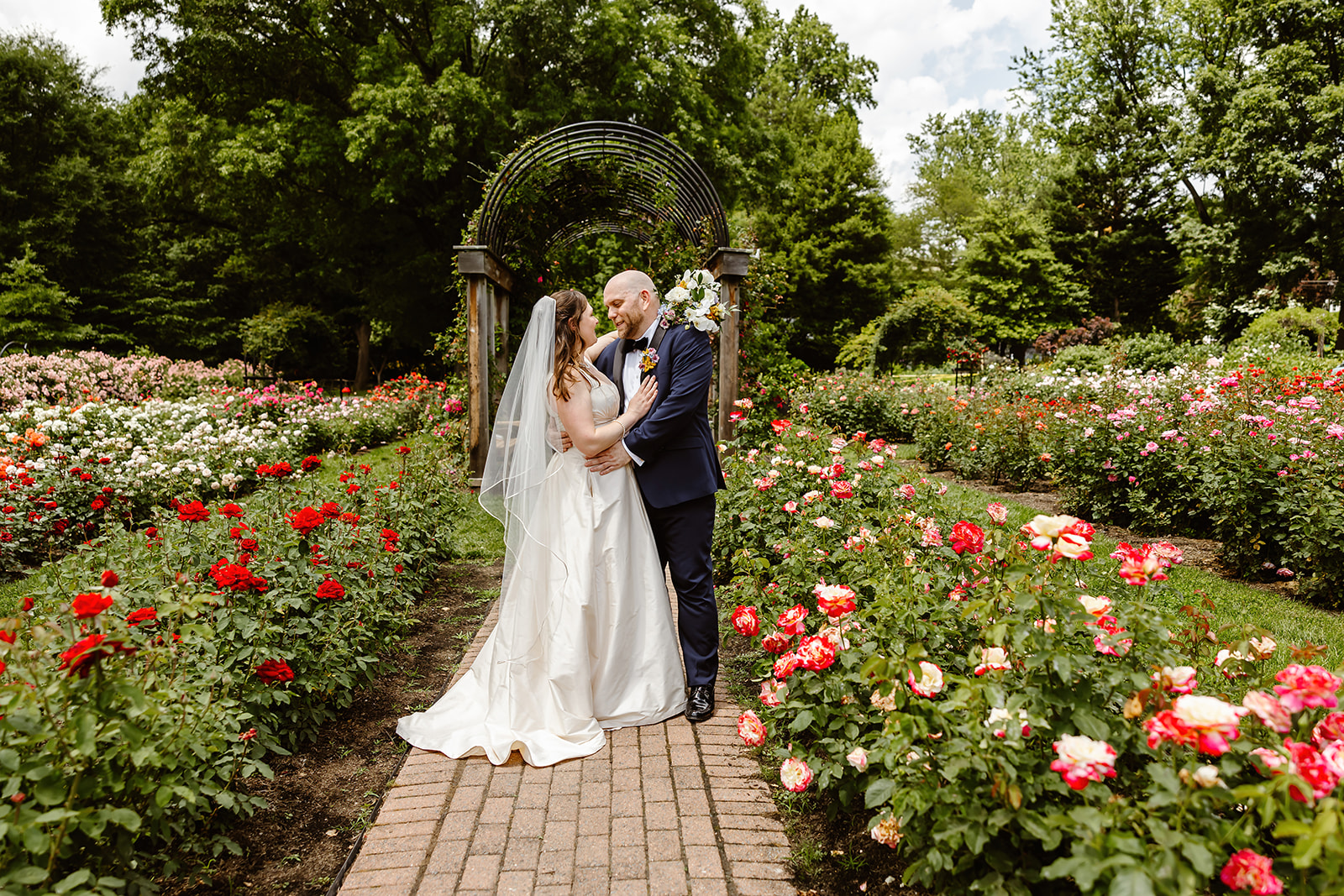 the wedding couple in the rose garden