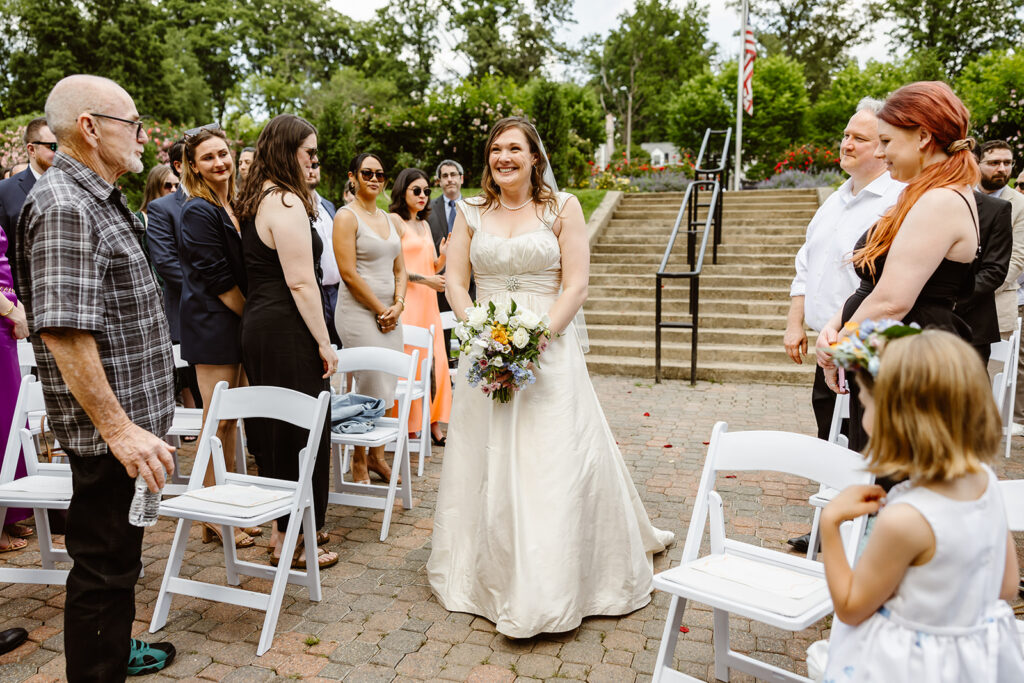 the wedding couple walking down the aisle for their wedding