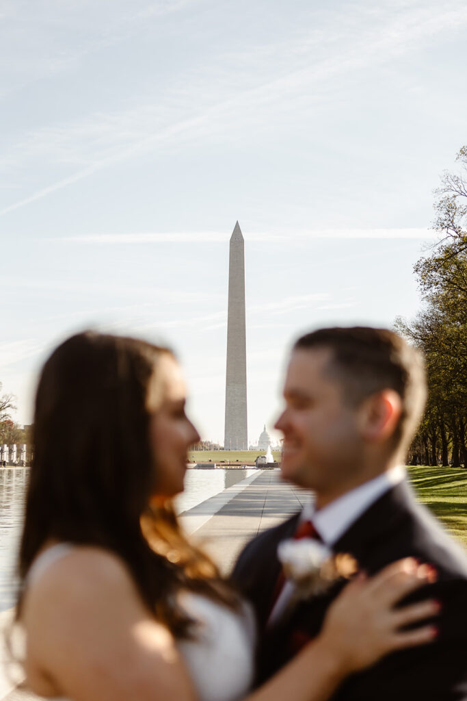 wedding Couple taking photos on the National Mall by the Washington Monument