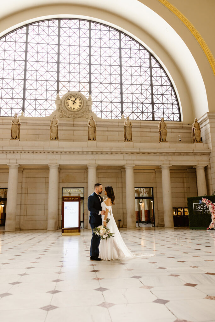 the wedding couple posing at the Union Station