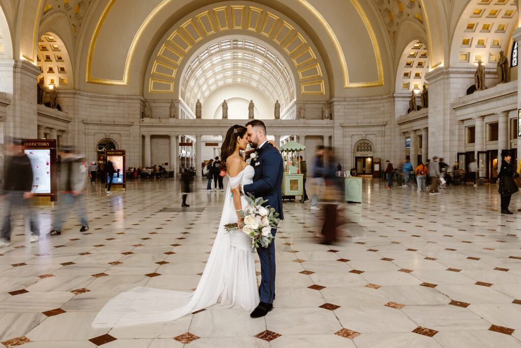 the wedding couple inside of the Union Station for wedding photos