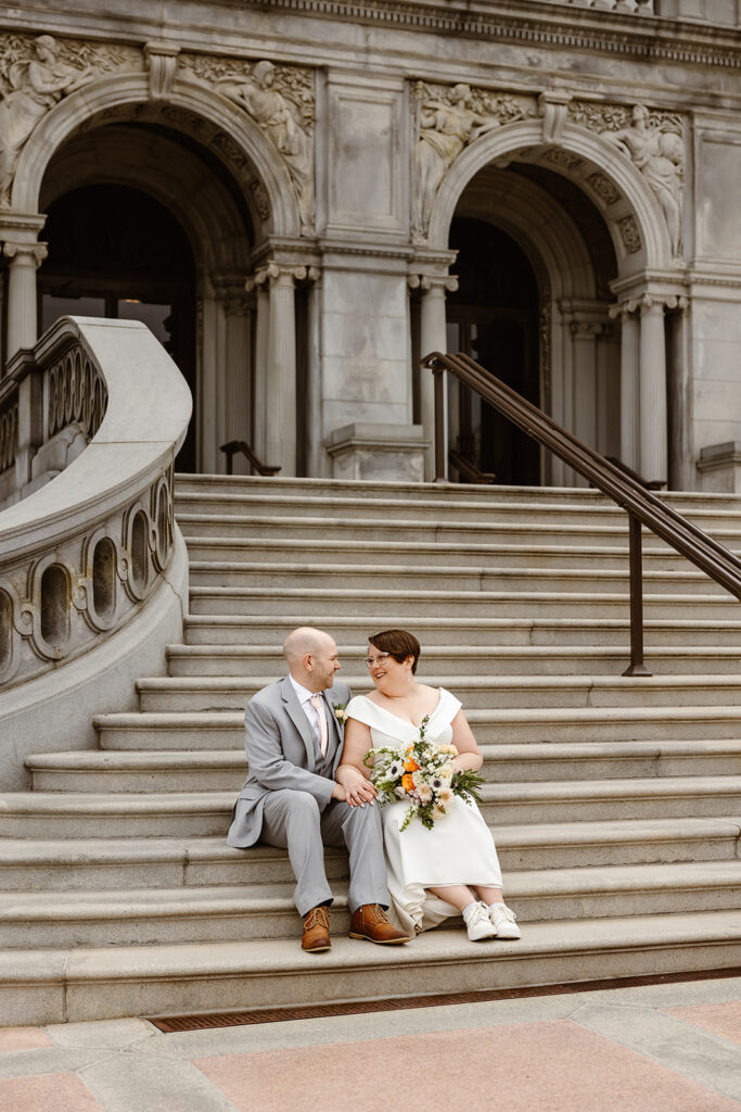 the wedding couple on the steps of the Library of Congress