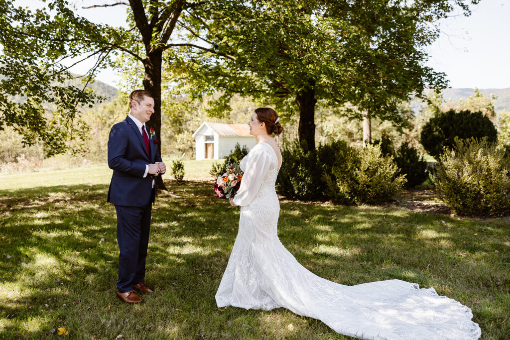 the wedding couple in the front yard of the VRBO for a first look