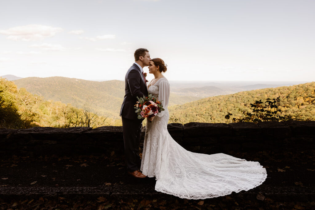 the wedding couple at Shenandoah National Park looking over the mountains