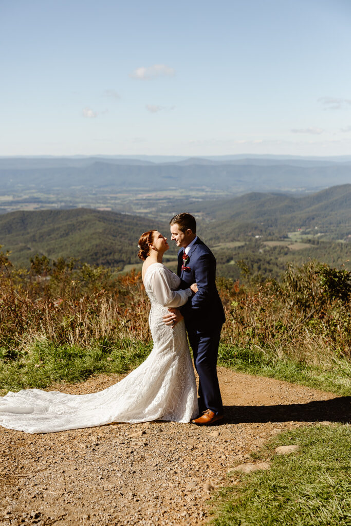 the wedding couple leaning in for a kiss at Shenandoah National Park