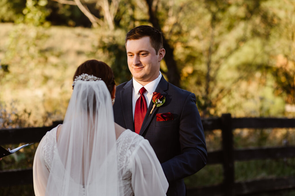 Groom looks at bride during the wedding ceremony.