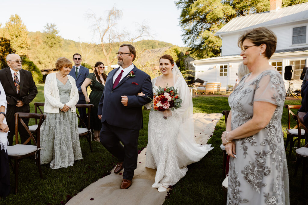 the bride walking down the aisle at the VRBO