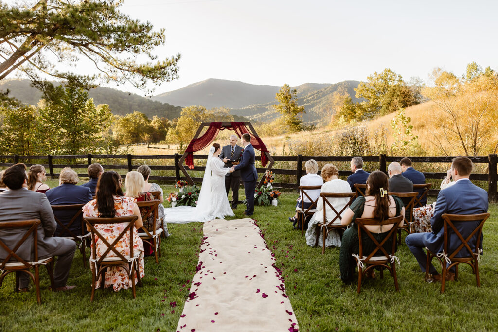 the wedding couple saying their vows with mountain views near Shenandoah National Park