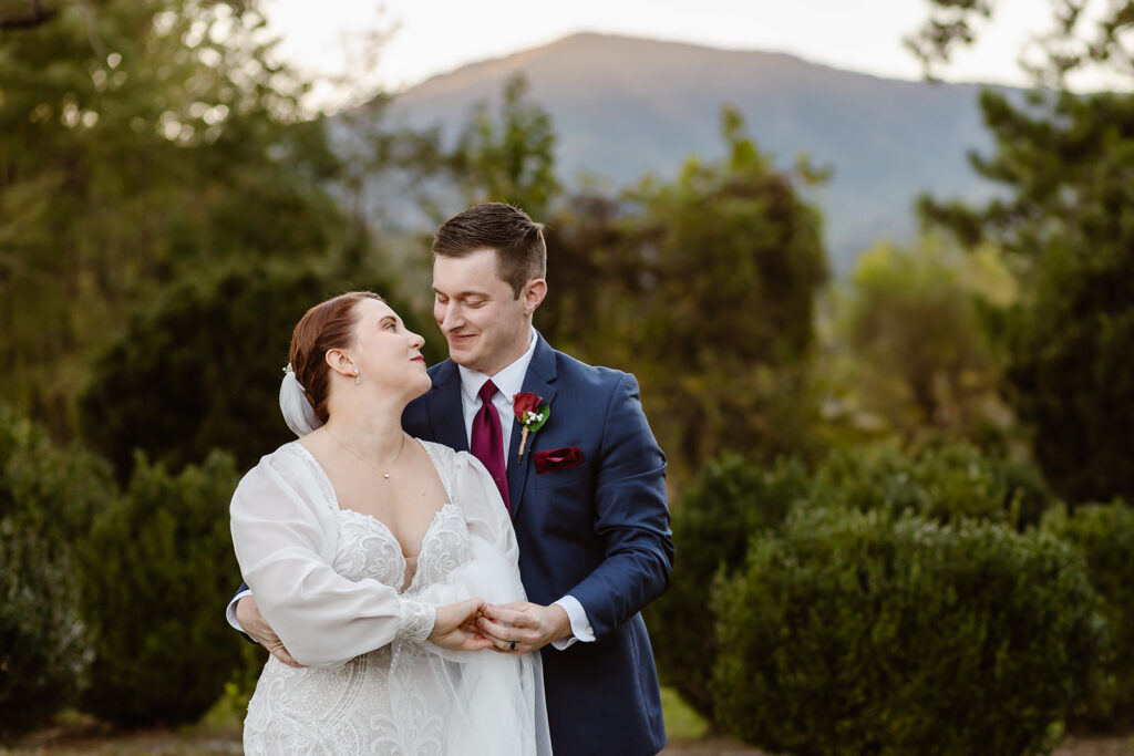 The elopement couple during their first dance with the Virginia mountains behind them