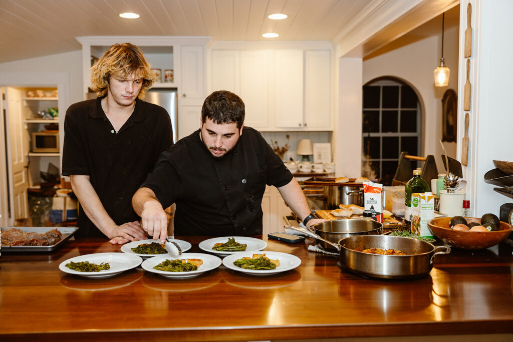 A private chef and his assistant prepare the dinner plates about to be serves to the elopement couple and their guests. 