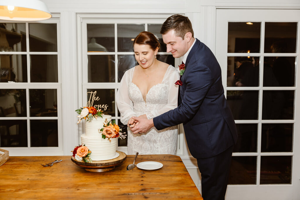 the wedding couple cutting cake at the VRBO