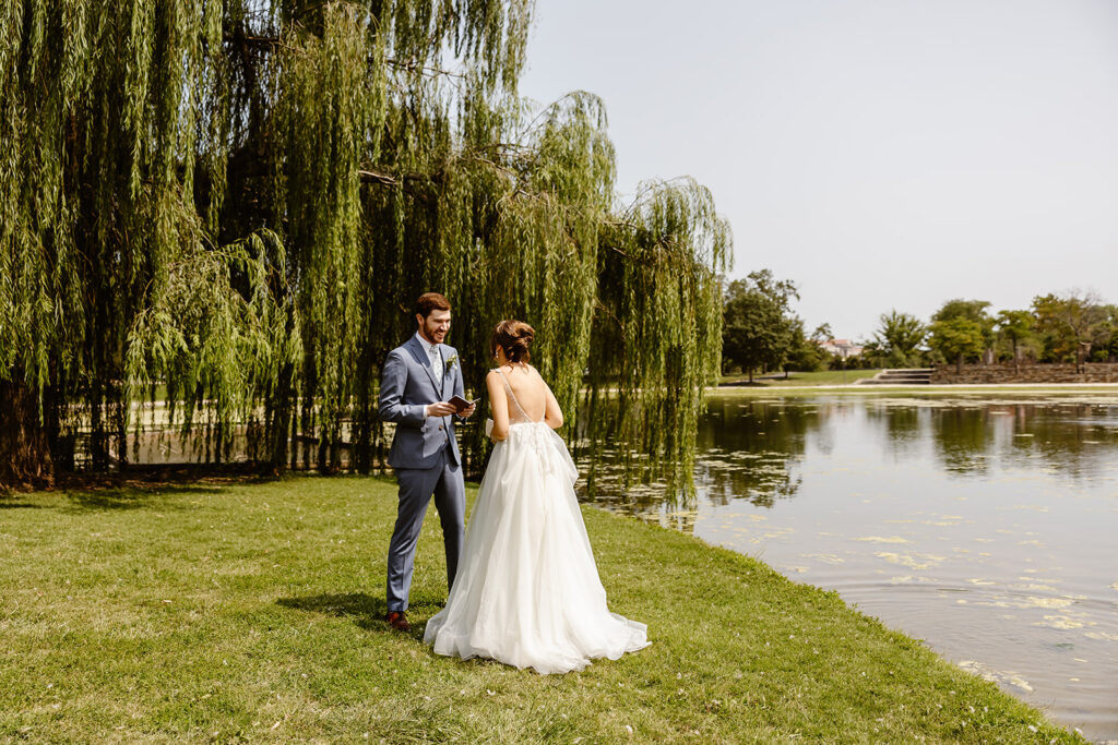 the wedding couple saying their private vows at the Constitution Pond