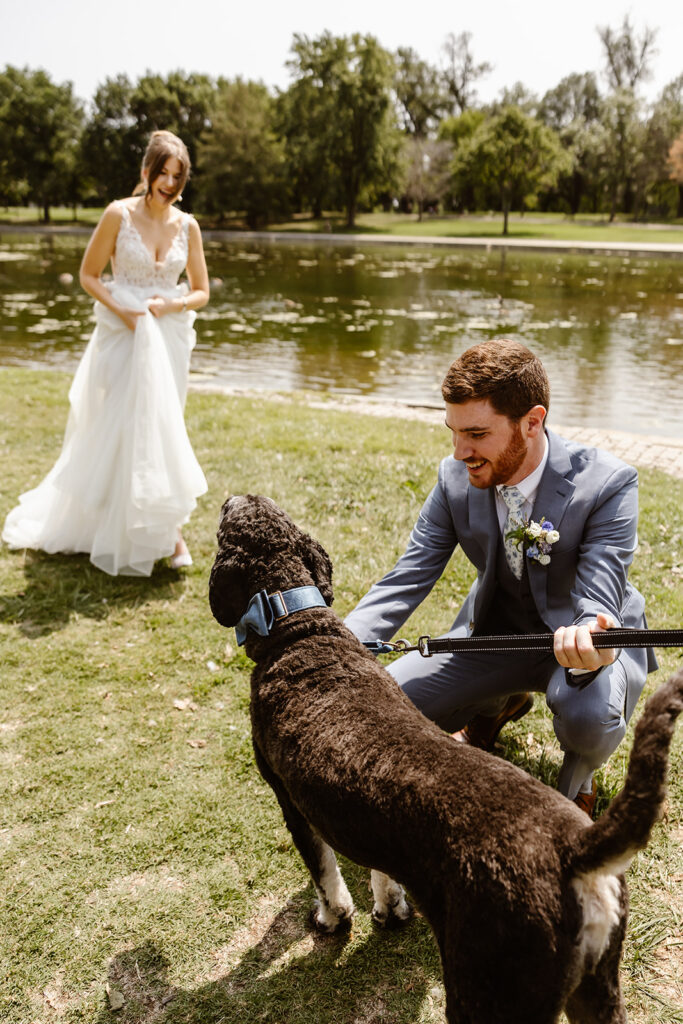 the wedding couple with their dog for wedding photos