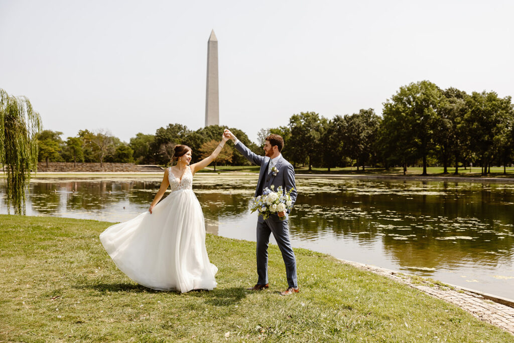 the wedding couple dancing in front the Washington Monument 