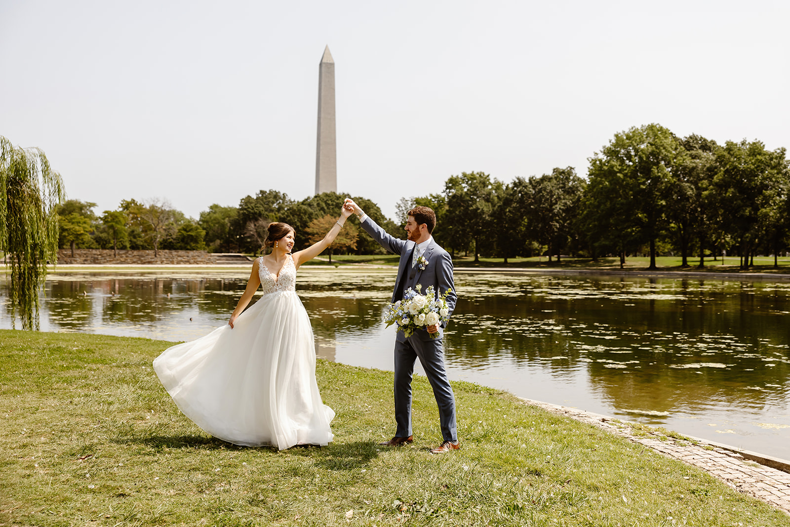 the wedding couple dancing in front the Washington Monument