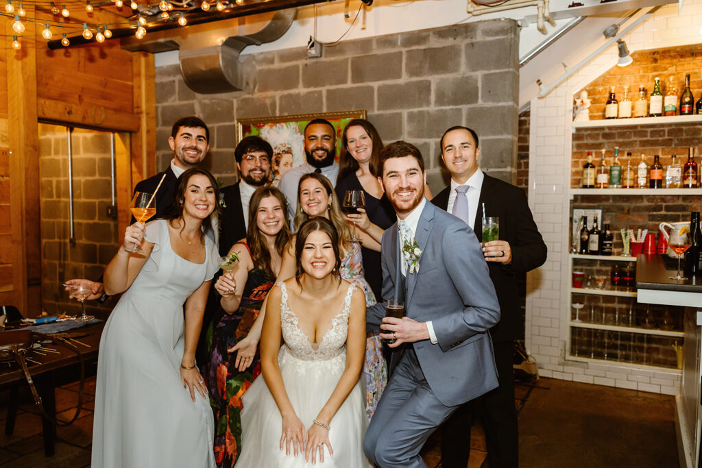 the bride and groom smiling with their guests