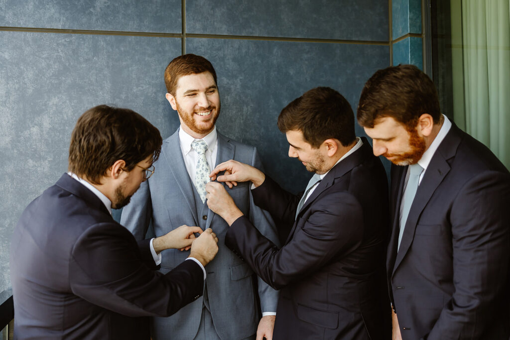 the groomsmen and the groom getting ready for the DC wedding