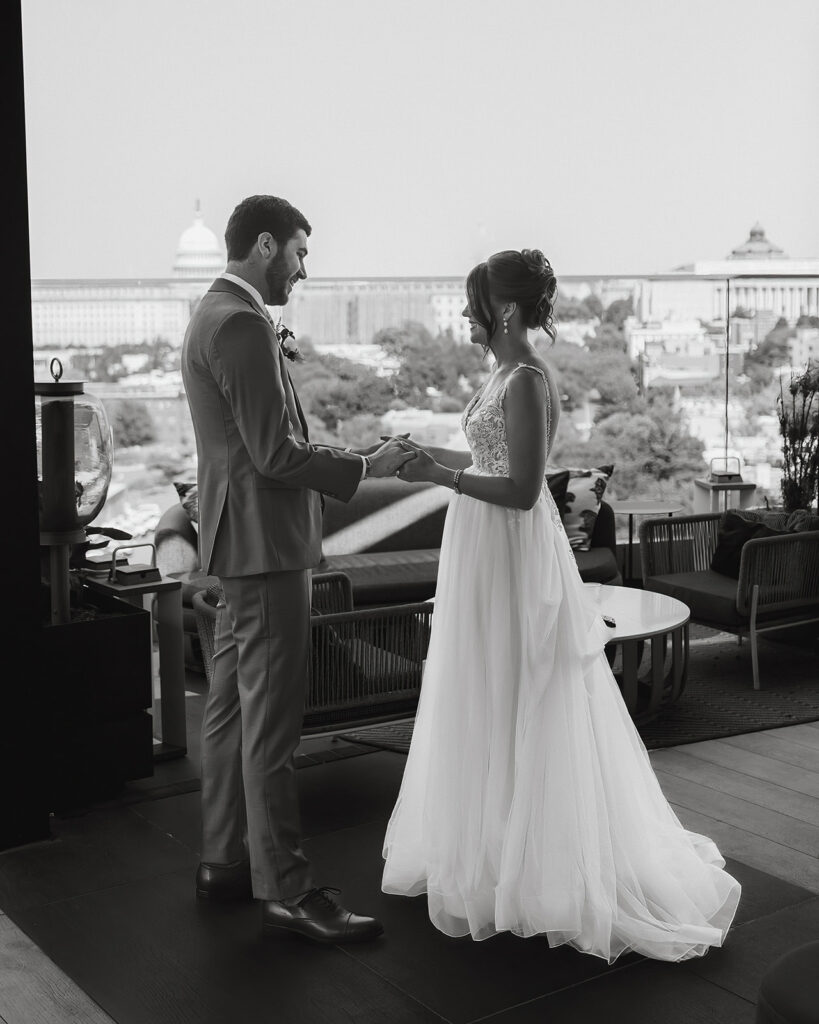 the black and white wedding photo of the wedding couple on the rooftop 