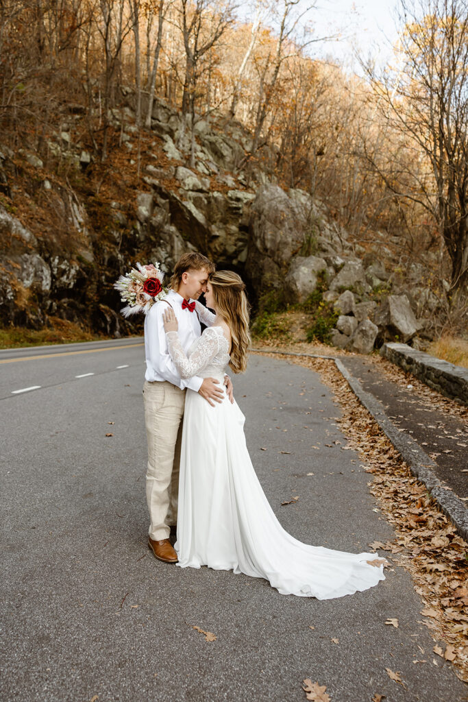 the wedding couple at Shenandoah National Park in the fall 