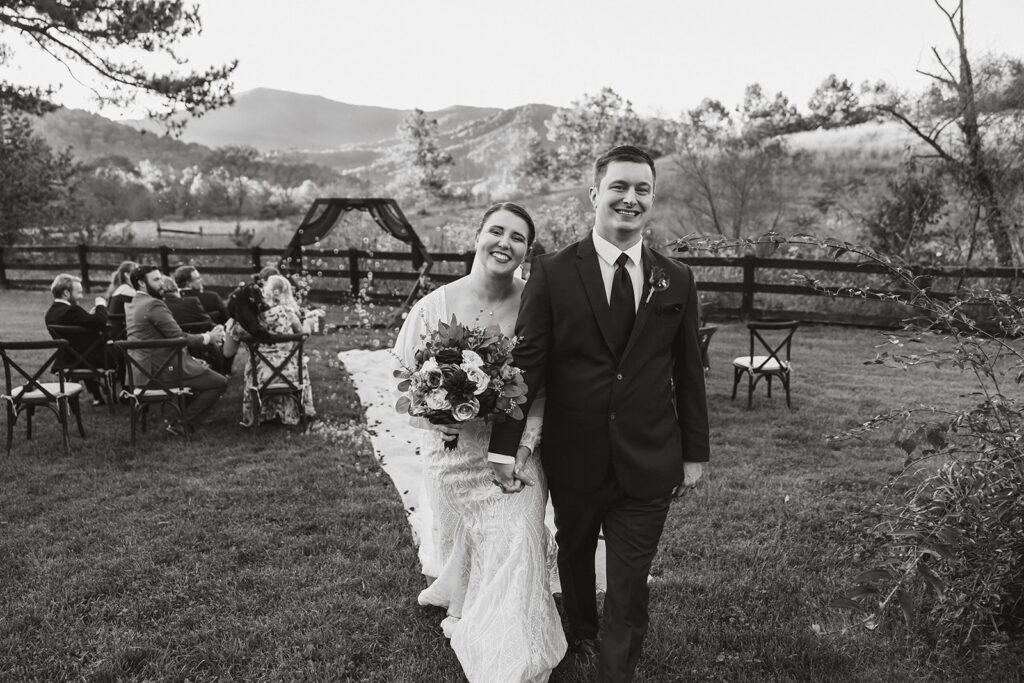 the wedding couple walking down the aisle