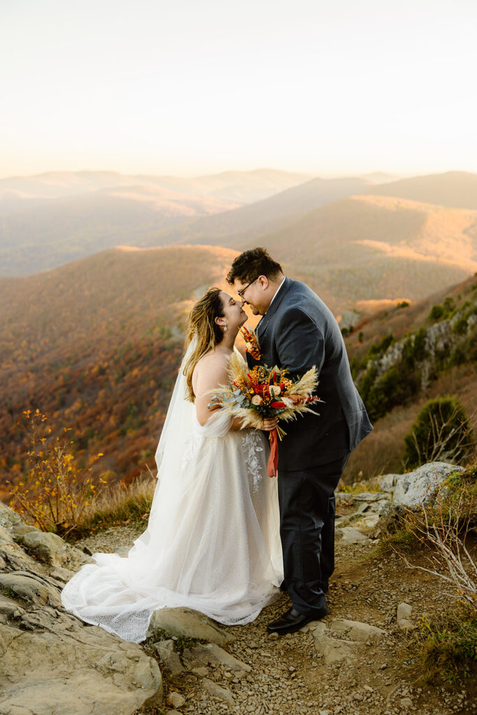 the wedding couple kissing during their elopement ceremony