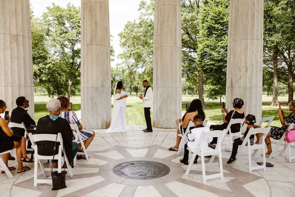 the wedding couple getting married in the DC War Memorial