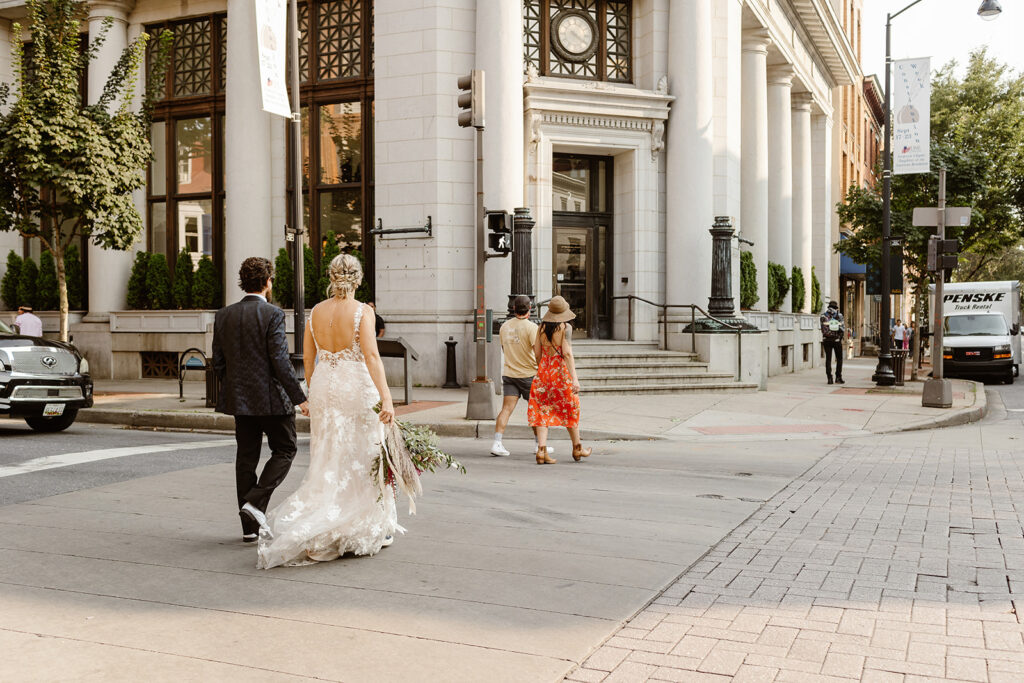 elopement couple walking towards the citizens ballroom