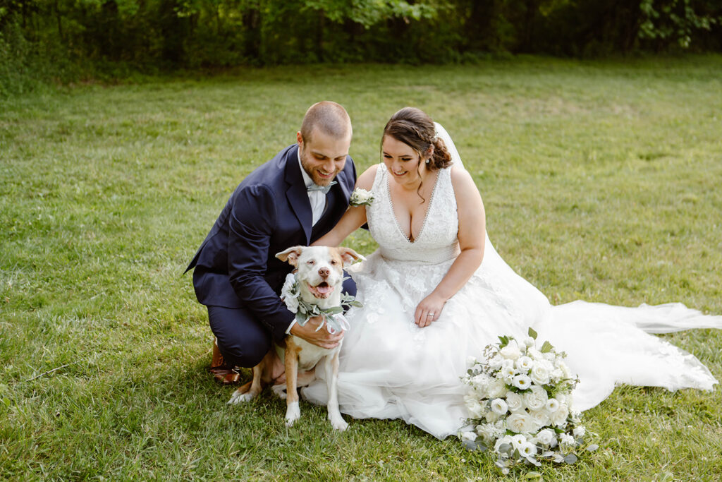 happy wedding couple with their dog

