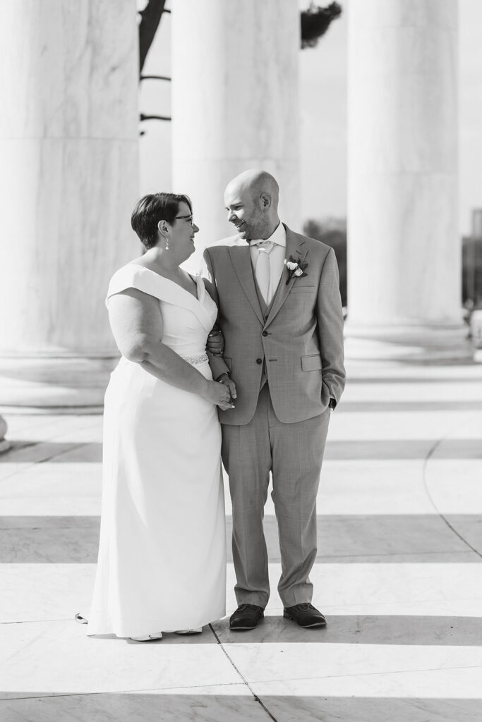 elopement couple exploring washington dc during their cherry blossom wedding day