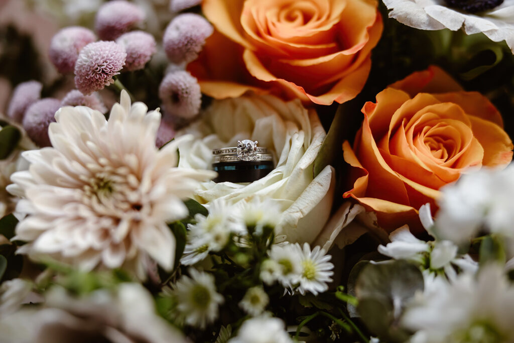 elopement detail close up, rings inside a rose