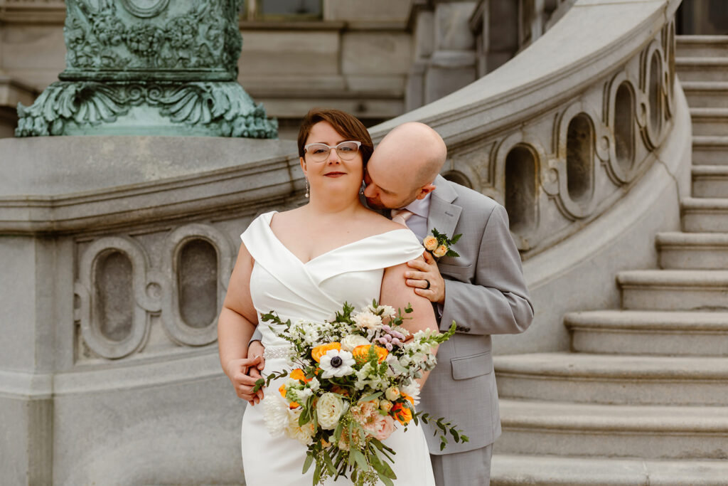 elopement couple exploring washington dc during their cherry blossom wedding day
