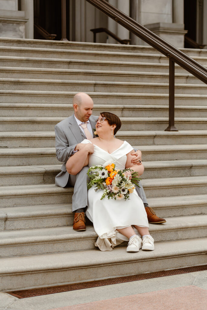 elopement couple exploring washington dc during their cherry blossom wedding day