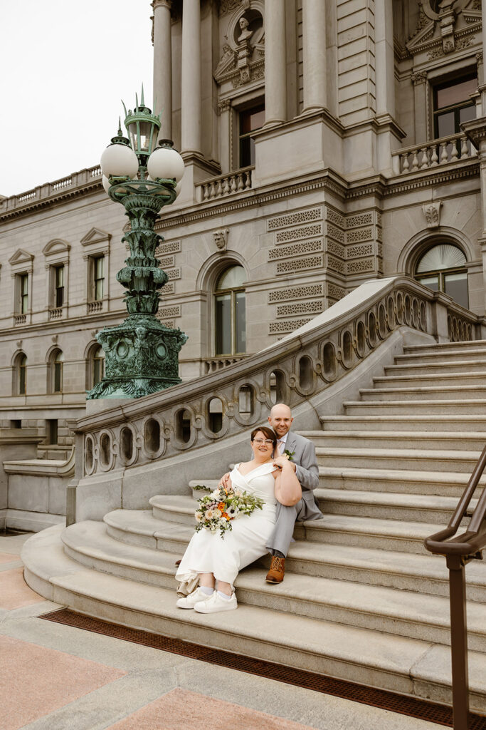 elopement couple exploring washington dc during their cherry blossom wedding day