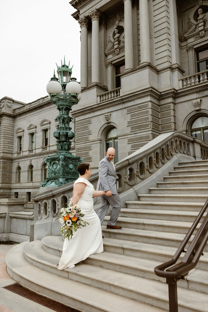 elopement couple exploring washington dc during their cherry blossom wedding day