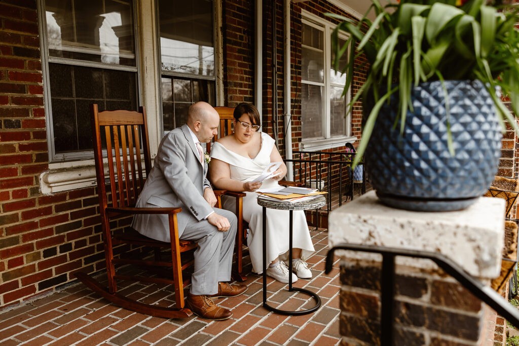 elopement couple reading letters together written by their loved ones